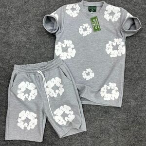 Gray two piece set features a short sleeved crew necklace and matching shorts
